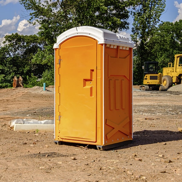 what is the cost difference between standard and deluxe porta potty rentals in Hugo